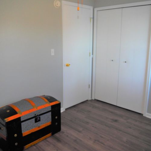 Bedroom #2 (main floor):  includes a futon, workstation (desk, chair, and monitor), ceiling fan, closet, and another lovely lake view!