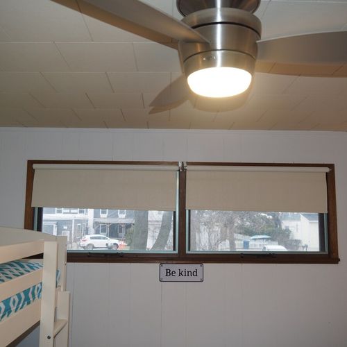 Bedroom #2:  features a full-size bed, bunk bed (i. E. 2 single beds on top of each other), ceiling fan, dresser, mirror, and closet.