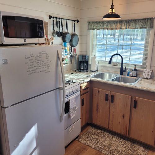 Kitchen:  the cabin has a cute little kitchen with all appliances except for a dishwasher. Includes a good supply of cooking and dining utensils as well.
