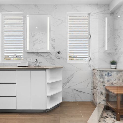 Wake up to luxury in this modern, marble-clad bathroom