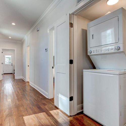 Convenient in-unit washer & dryer tucked into a tidy laundry space.