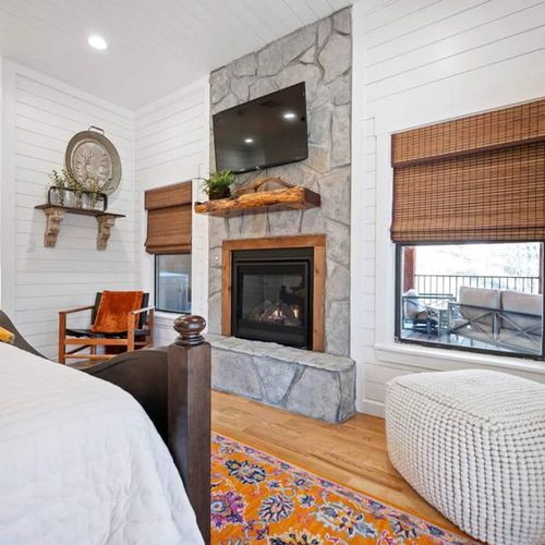 A floor to ceiling fireplace and smart tv in the King Suite!
