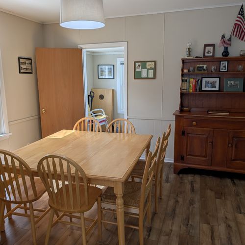 DINING ROOM:  Large family-friendly dining room with new flooring and seating for up to 8 adults