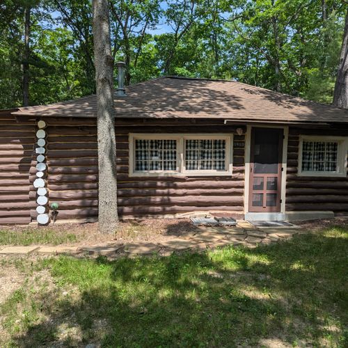 Overall:  the front of the cabin in summer.