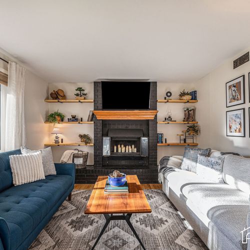 Relax in the heart of the home, our cozy living room with chic country decor. Kindly note the fireplace is not in use due to safety purposes.