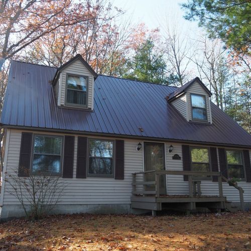 Exterior:  a closer view of the front of the cabin in fall.