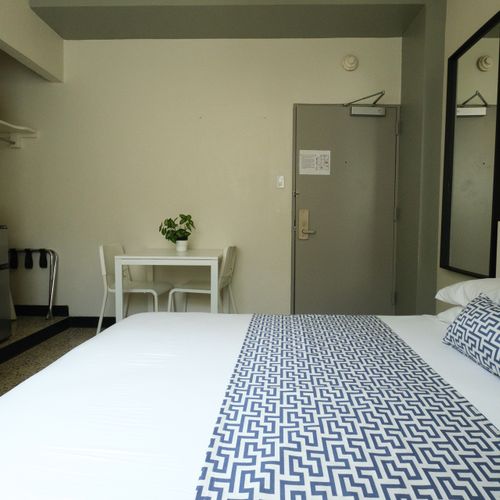 Enjoy the convenience of a studio setup, featuring a cozy sleeping area, a functional dining table for meals or work, and ample space for a comfortable stay.