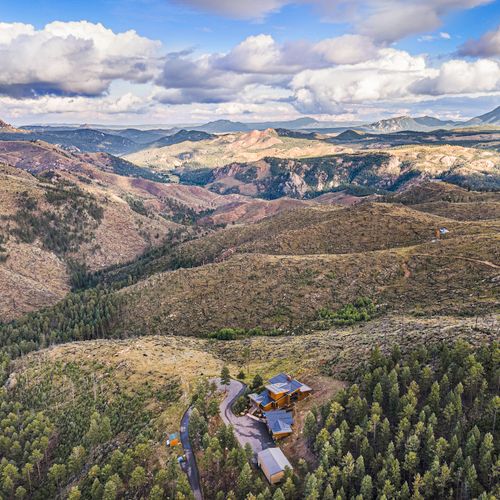 Bird's-eye perspective of expansive lux hideaway, a luxurious sanctuary in the colorado wilderness.