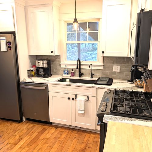 KITCHEN (MAIN FLOOR):  Fully-functional modern kitchen with newer appliances including a dishwasher and a gas range.