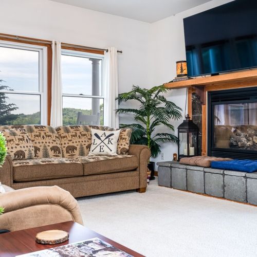 Overall:  the home has a gorgeous living room with a gas fireplace, great views of betsie lake, and a large television with live streaming.