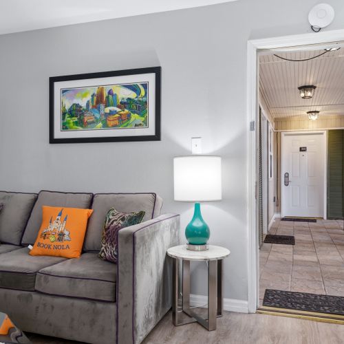 Living room w/ a view straight to the entryway — open & welcoming.