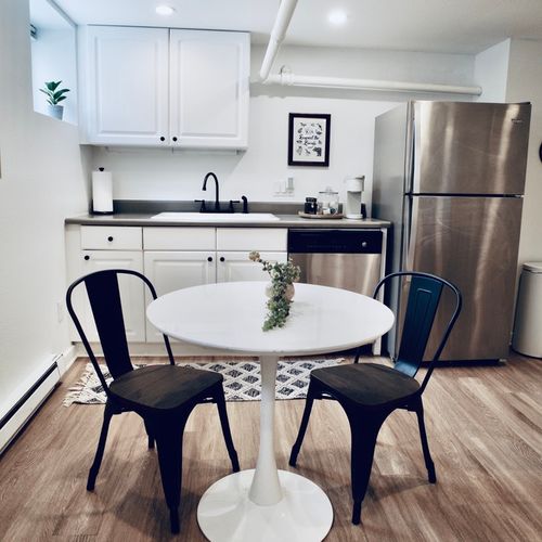 Fully equipped basement kitchen with a fridge for your favorite cold drinks.