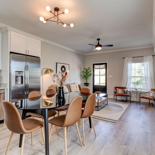 Spacious dining area w/ a table ideal for sharing meals together.