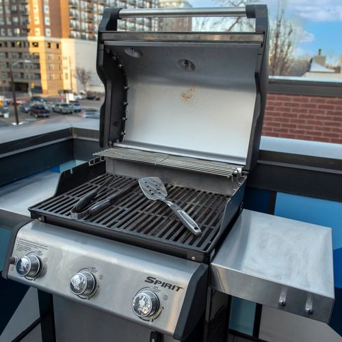 Rooftop grill ready for casual cookouts, sunset dinners, and memorable evenings together.