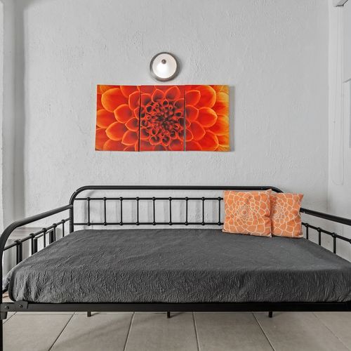The bright and airy space features contemporary art and a comfortable sofa for a relaxing stay.