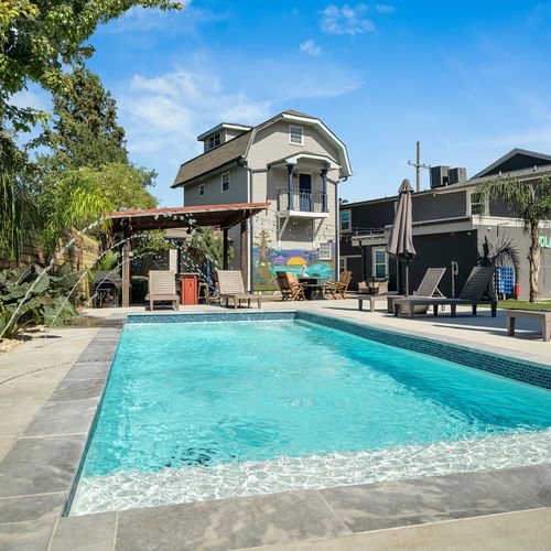 Dive into relaxation at our pristine pool, surrounded by lush greenery and ample seating. Perfect for cooling off and unwinding under the New Orleans sun.