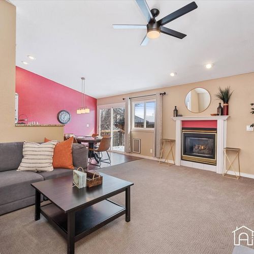- relax in this vibrant and inviting living space with cozy seating and a sleek fireplace
- red accent wall adds personality while neutral tones keep it comfortable
- perfect for lounging, reading, or enjoying movie nights with loved ones
