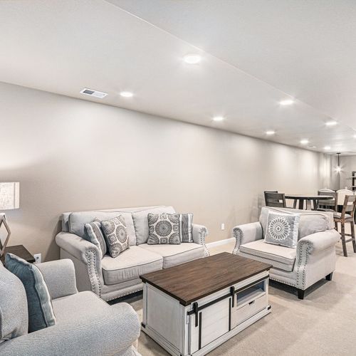 The ground-floor family room offers a cozy setup with flexible space for groups.