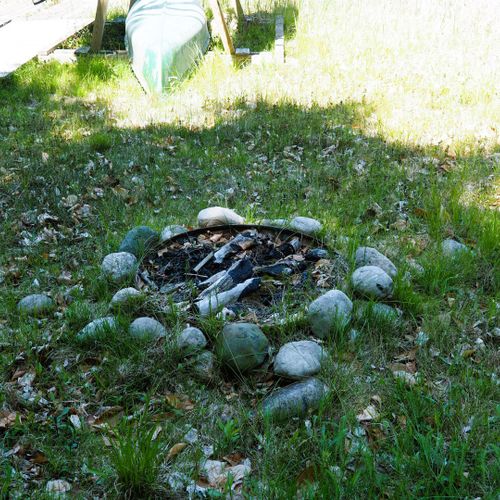 Exterior:  the lakeside firepit that is available for guests to use.