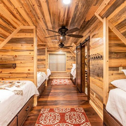 The bunk room with 3 Queens and 2 Twin XL beds