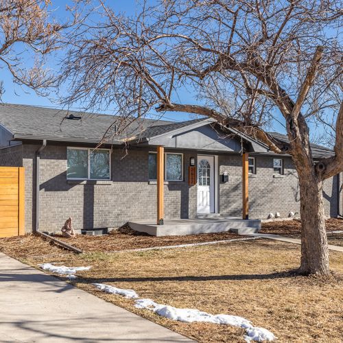 The house features a large driveway that fits 3-4 cars.