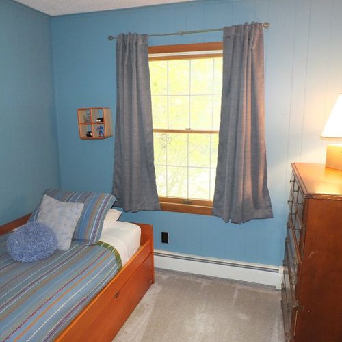 Bedroom #3:  features a trundle (i. E. 2 twin beds), a dresser, and a closet.