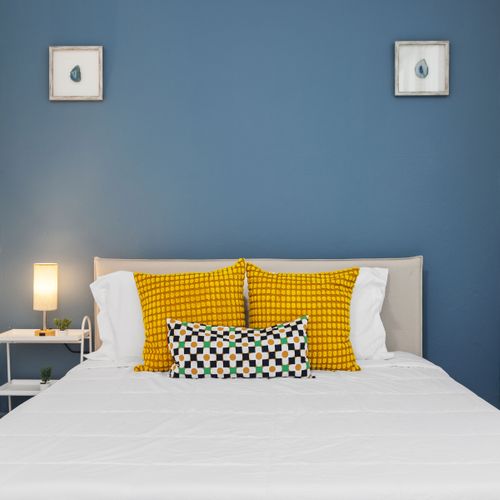 Condado | Puerto Rico Vacation Rental 35 "Sun-Kissed Slumbers: Wake up refreshed in this bright and airy bedroom, boasting a contemporary design and an abundance of natural light, ensuring a delightful start to your day.