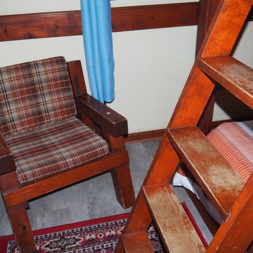 Bedroom #2:  features a full-on-full bunk bed, dresser, closet, and chair.