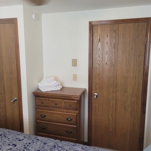 Bedroom #2:  features a full-size bed, ceiling fan, dresser, and closet.