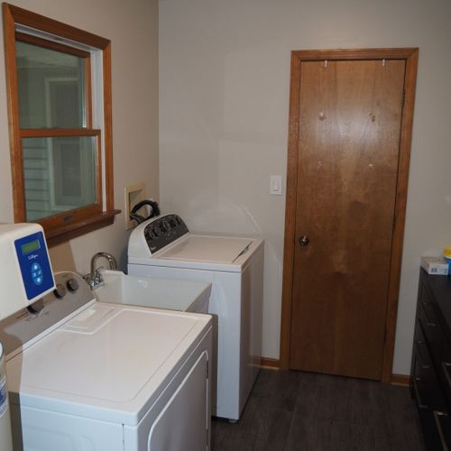 Laundry room:  the cottage has a very convenient laundry room with a washer, dryer, and laundry sink. The half-bath is at the back of the laundry room behind the door.