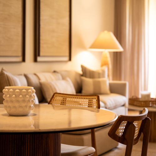 Experience modern coastal charm! Our living and dining area blends comfort with elegant, inviting decor.