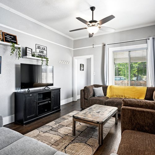 The living and dining rooms have enough space for everyone! Relax and catch a movie on the flat screen tv.