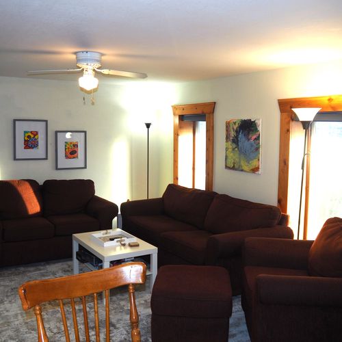 Living room:  super comfy with a sofa, loveseat, plush chair, coffee table, ceiling fan, and huge 55" live-streaming television with roku.
