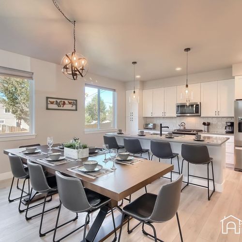 This bright and airy dining room is the perfect spot for dinner parties and family meals. The neutral tones create a warm ambiance that is great for congregating and conversation.
