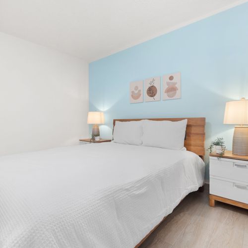 A clean and cozy bedroom with a minimalist design.