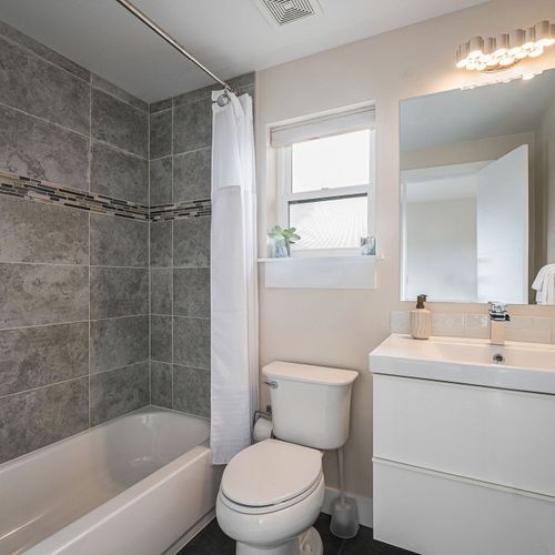 Unwind after a long day in our third-floor bathroom's tub/shower combo.