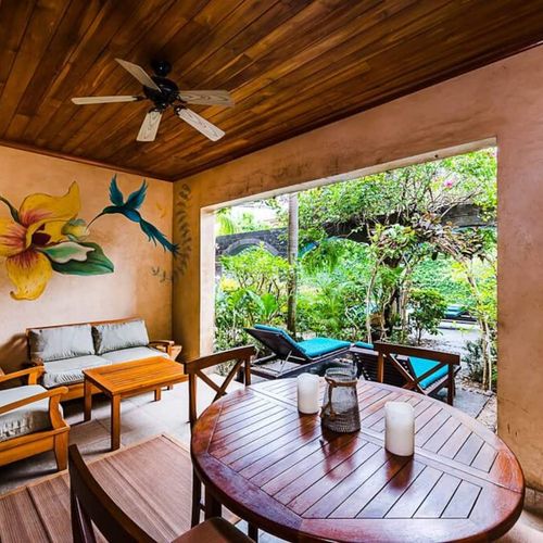 Come and relax on the outdoor porch with a view of the pool.