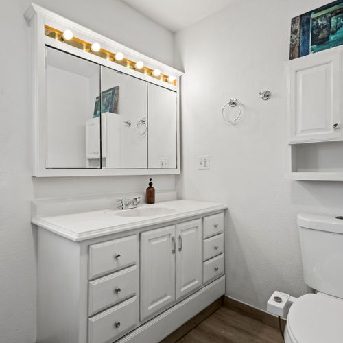 Spotless white bathroom designed for a fresh, clean feel.