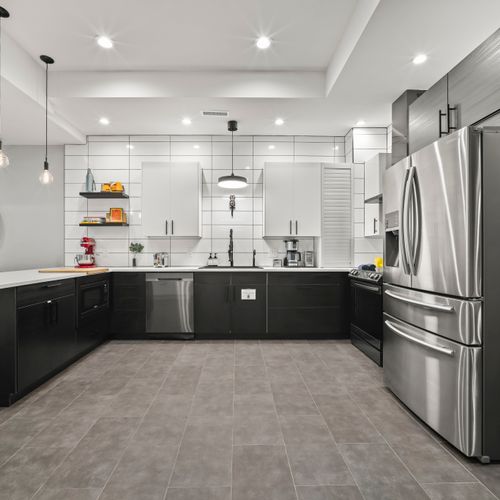 Fully equipped modern kitchen with stainless appliances, perfect for cooking and gathering together.