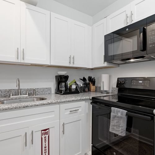 Sleek kitchen w/ modern appliances & plenty of counter space