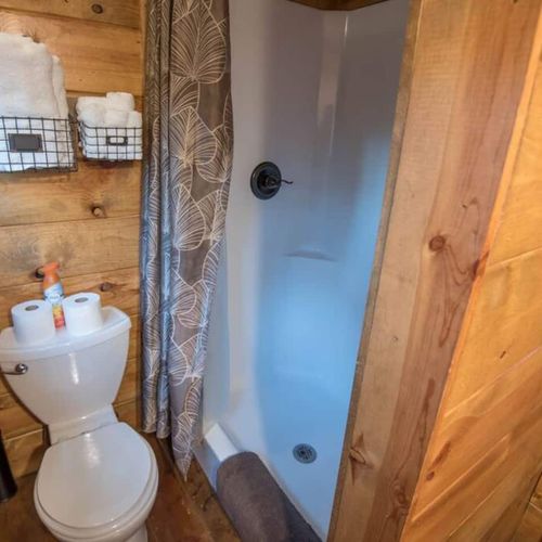 Room 3/4 upstairs holds a Queen as well as an exit to outside. Private full bath