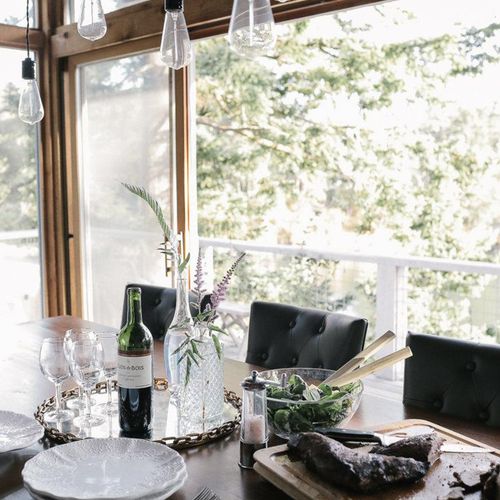 Dining table with seating for ten.  Kitchen island is adjacent with seating for six.