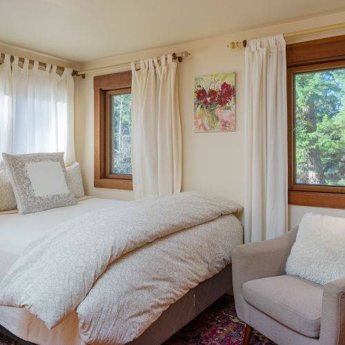 Tucked into an alcove with reading lights and windows all around.