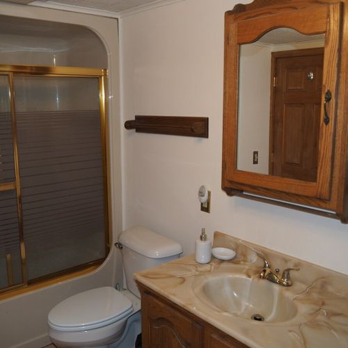 Bathroom #1:  full bathroom with a combination tub and shower. The washer and dryer are also in this bathroom.