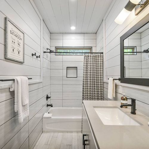 The private bunk bathroom has a tub and shower.