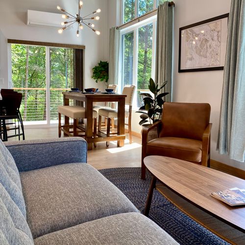 Morning light pours in as the Sputnik chandelier crowns your dining table — a perfect Orcas Island morning."