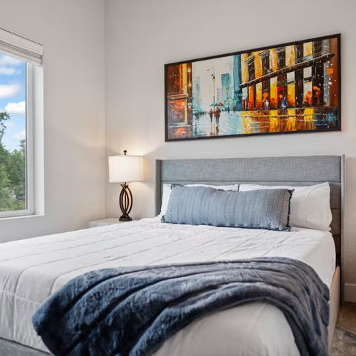 Neutral tones and contemporary artwork create a restfull vibe.