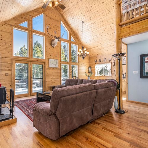 Cozy seating with a peaceful pineview.