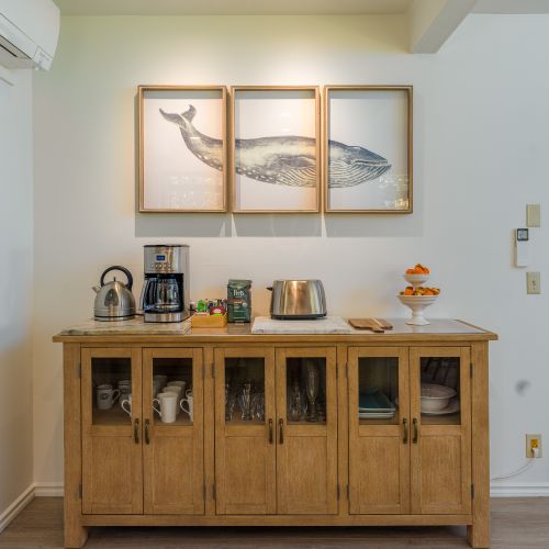 Dedicated coffee bar with Cuisinart drip coffeemaker, electric kettle, coffee grinder, French Press, coffee bar with sweeteners, tea and Peet's Organic coffee.