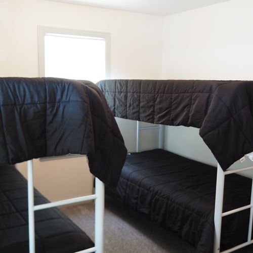 Bedroom #3:  features two bunk beds, so 4 people can sleep in the bedroom. Note that all bedding is provided.